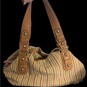 Gently used Fossil multicolored canvas leather-handled handbag.